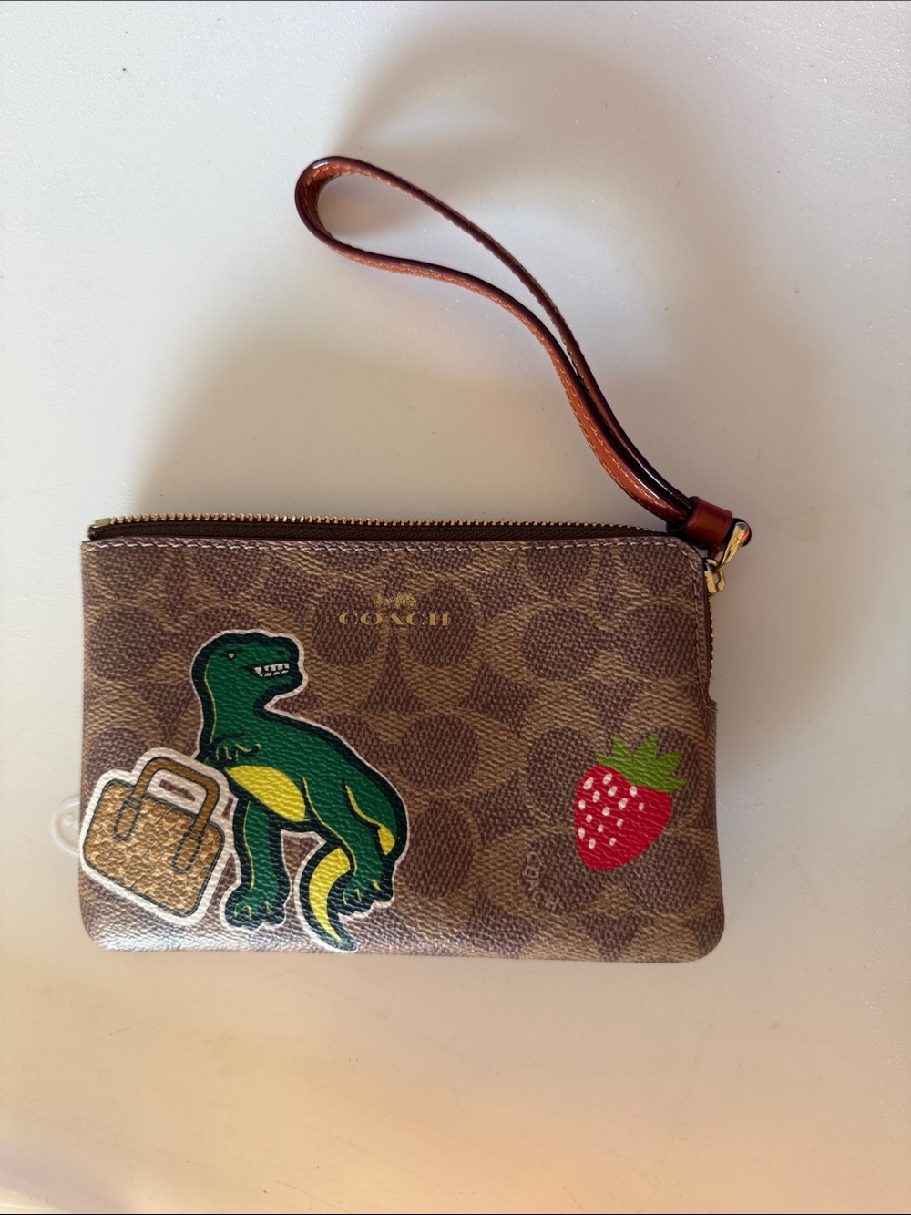 Coach Brown Signature Canvas Wristlet with Green Dino & Red Strawberry